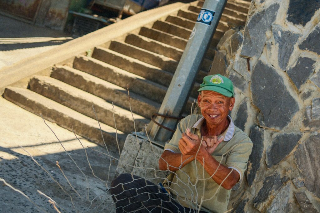 Fisherman smiling in Hoi An, Vietnam.